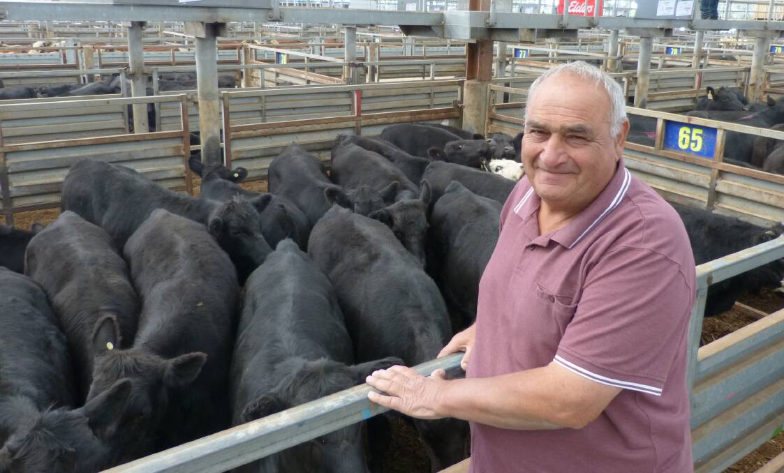 Great sale: Michael Lizza, Ferntree Gully, was all smiles after selling this pen of Angus steers, 340 kilograms, sold for $1000, or 286 cents per kilogram liveweight. Michael had to sell as the creek on his property has dried up.