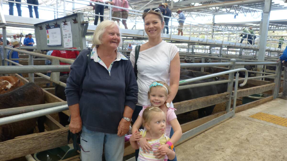 The Hauptmann family, Janet, left, Katherine with Myra and Fiona, were at Wangaratta to watch their steers and heifers sell, in a firm to cheaper sale.
