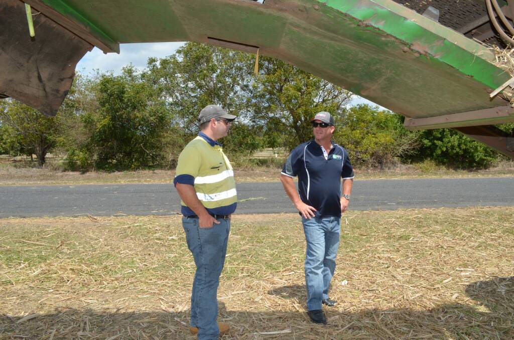 Herbert growers Andrew Irvin and Darren Reinaudo at a Childers farm where SRA-
recommended best harvesting practices have reduced sugar losses in the field.