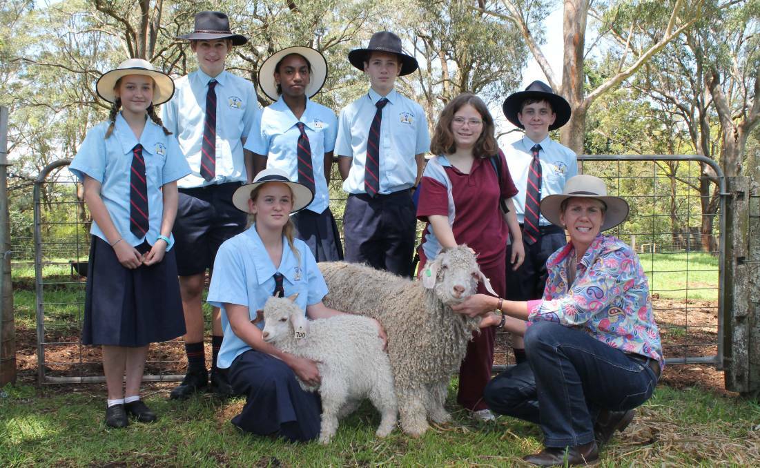 Chinchilla Christian College getting up close and personal with Jessica Angus and teacher Debbie Goudie Oakey High school and their Angora goats at a Moo Baa Munch event at Downlands College, Toowoomba last year.