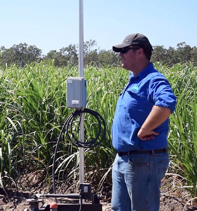 Horseshoe Lagoon cane grower Andrew Cross inspects some of the automated irrigation infrastructure on Russell Jordan's Upper Haughton cane farm.
