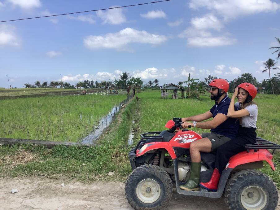 Tourists enjoy a quad-bike tour through the countryside near Ubud in Bali.