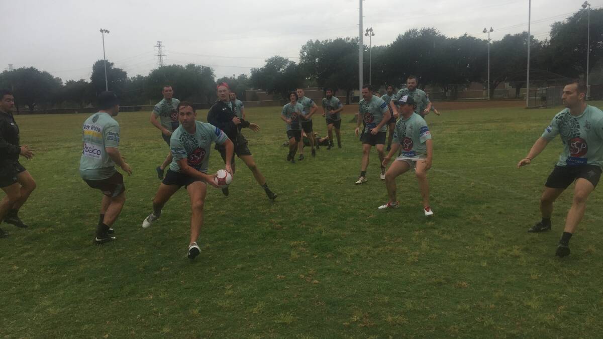 The Outback Barbarians trained in wet and cold conditions in preparation for Monday evening's game in Dallas. 