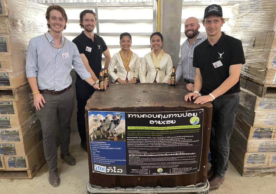 Brothers Dougal Cameron and Alexander Cameron with Chanthida Sisana and Sounisa Phoiugsavath and brothers Daniel Olsson and Josh Olsson in the AgCoTech factory in Luang Prabang.